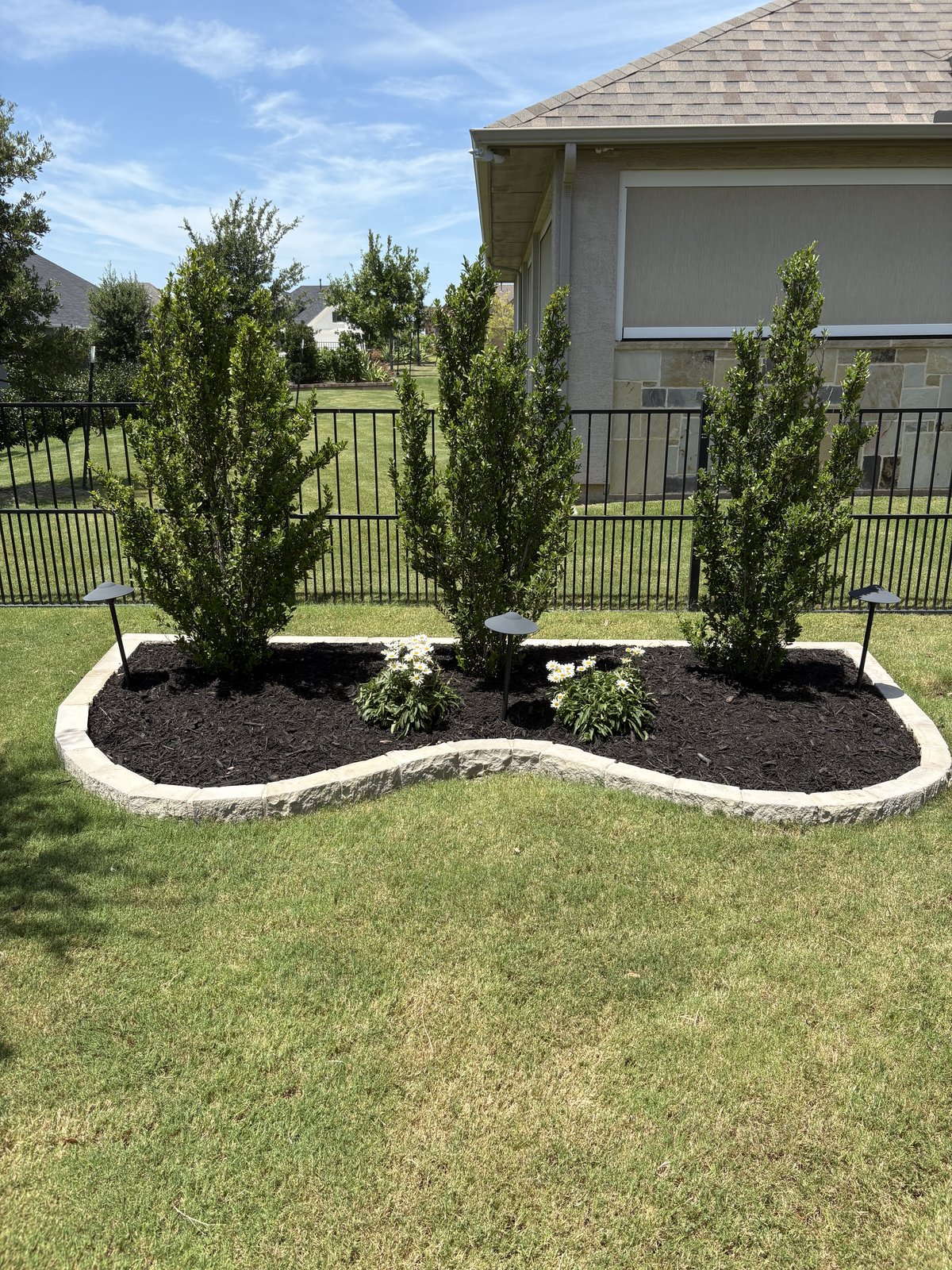 Tree planting and mulch bed in Denton TX